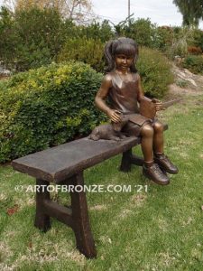 Study Buddy bronze sculpture of seated girl playing with her dog