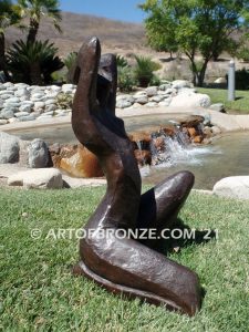 Sunbathing bronze sculpture of exotic and seductive modern/abstract woman for private gallery or public display