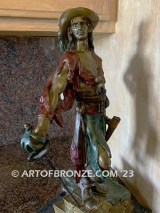 classical standing pirate holding sword with treasure chest under his foot bronze sculpture