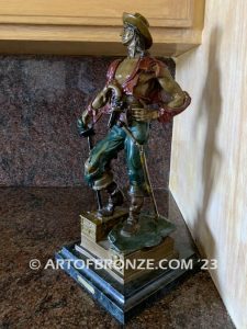 classical standing pirate holding sword with treasure chest under his foot bronze sculpture