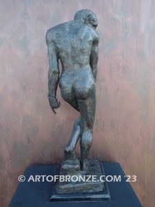 Agony figurative statue of tormented nude male with tightened musculature and twisting body