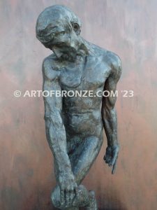 Agony figurative statue of tormented nude male with tightened musculature and twisting body