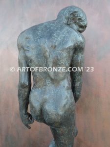 Agony figurative statue of tormented nude male with tightened musculature and twisting body