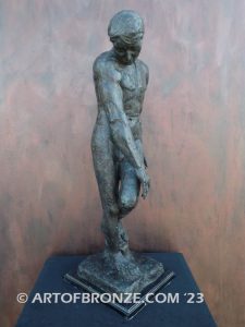 Agony figurative statue of tormented nude male with tightened musculature and twisting body