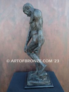 Agony figurative statue of tormented nude male with tightened musculature and twisting body