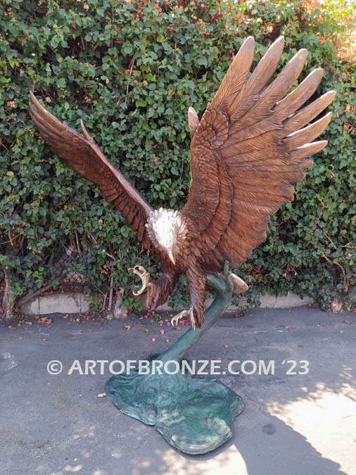 Thunder and Lightning heroic bronze eagle statue anchored to a bronze base and branch