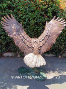 Thunder and Lightning heroic bronze eagle statue anchored to a bronze base and branch