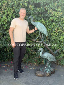 Mashland Waders lost wax casting of two heron cranes resting on branch at tranquil residence