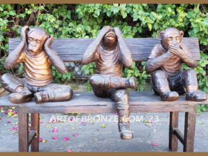 Hear See Speak No Evil special edition bronze statue of monkeys sitting on bench