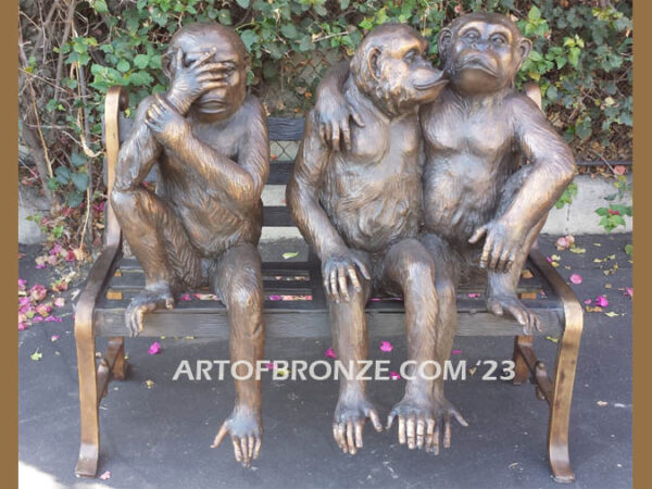 Threes a crowd whimsical bronze statue of three monkeys sitting on bronze bench