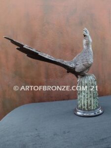 Desert Runner bronze statue of roadrunner perched atop a bronze cactus