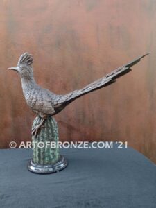 Desert Runner bronze statue of roadrunner perched atop a bronze cactus