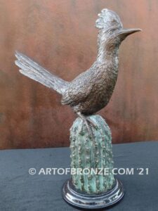 Desert Runner bronze statue of roadrunner perched atop a bronze cactus