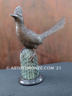 Desert Runner bronze sculpture of roadrunner resting atop a cactus