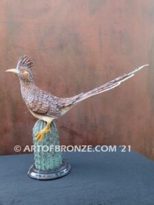 Desert Runner bronze sculpture of roadrunner resting atop a cactus