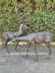 Field of Dreams outdoor monumental bronze buck and doe pair standing sculptures