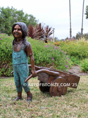 Gardening Day bronze statue of girl pulling wheelbarrow/cart for yard display