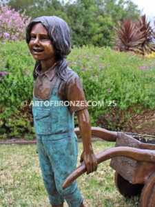 Gardening Day bronze statue of girl pulling wheelbarrow/cart for yard display