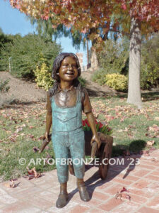 Gardening Day bronze statue of girl pulling wheelbarrow/cart for yard display