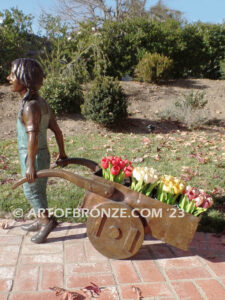 Gardening Day bronze statue of girl pulling wheelbarrow/cart for yard display