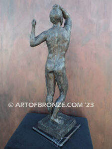 Age of Bronze figurative bronze statue of nude male with tightened musculature and twisting body