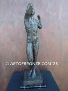 Age of Bronze figurative bronze statue of nude male with tightened musculature and twisting body