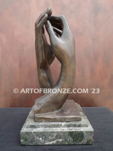 The Cathedral bronze sculpture of two life-like right hands touching