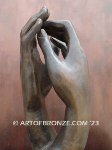 The Cathedral bronze sculpture of two life-like right hands touching