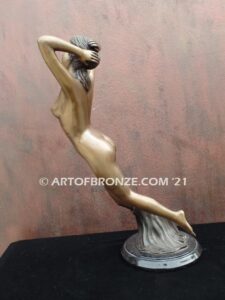 Daydream bronze statue of suspended nude woman in ethereal moment