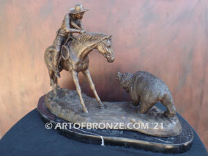 Fighting Chance bronze statue cowboy-on-horseback-encountering-a-wild-bear