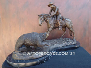 Fighting Chance bronze statue cowboy-on-horseback-encountering-a-wild-bear