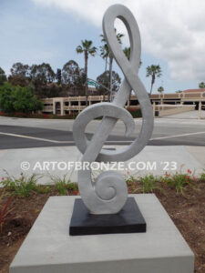 Signature of Time bronze sculpture of monumental Treble Clef musical note for Cogir Senior Living Center in Brea, CA