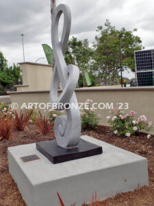 Signature of Time bronze sculpture of monumental Treble Clef musical note for Cogir Senior Living Center in Brea, CA