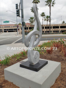 Signature of Time bronze sculpture of monumental Treble Clef musical note for Cogir Senior Living Center in Brea, CA