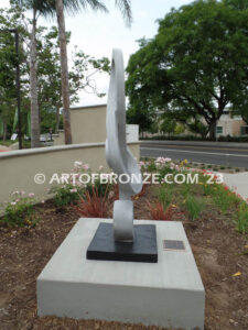 Signature of Time bronze sculpture of monumental Treble Clef musical note for Cogir Senior Living Center in Brea, CA