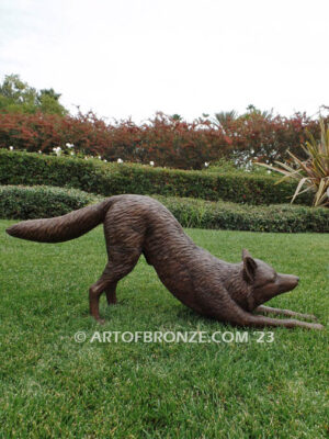 Alert bronze stretching fox mascot sculpture for gallery, art in public places or school