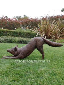 Alert bronze stretching fox mascot sculpture for gallery, art in public places or school