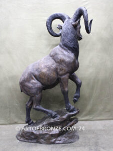 Big Horn Majesty monumental outdoor bronze sculpture ram on bronze rock ledge