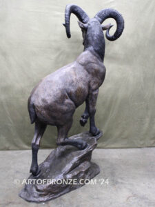 Big Horn Majesty monumental outdoor bronze sculpture ram on bronze rock ledge