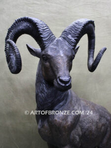 Big Horn Majesty monumental outdoor bronze sculpture ram on bronze rock ledge