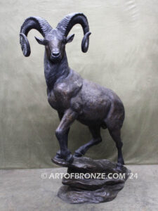 Big Horn Majesty monumental outdoor bronze sculpture ram on bronze rock ledge