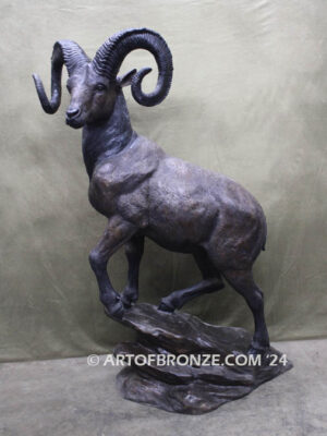 Big Horn Majesty monumental outdoor bronze sculpture ram on bronze rock ledge