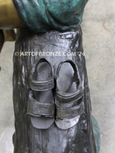 Break Time monumental bronze sculpture two children reading book on log