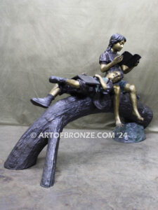 Break Time monumental bronze sculpture two children reading book on log