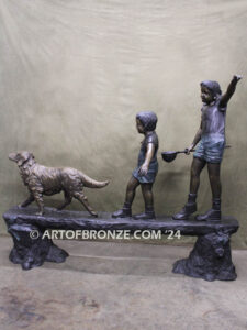 Day of Adventure bronze sculpture of two children and dog strolling across bronze log