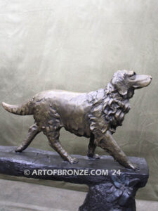 Day of Adventure bronze sculpture of two children and dog strolling across bronze log