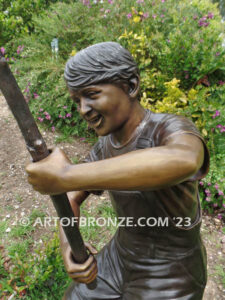 Fisher Boy bronze statue of young boy holding pole and trying to catch a fish