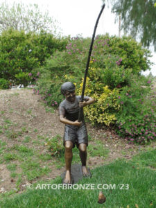 Fisher Boy bronze statue of young boy holding pole and trying to catch a fish