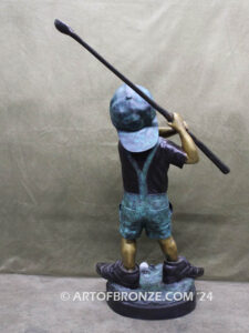 In My Fathers Shoes bronze sports statue of budding golfer boy hitting ball