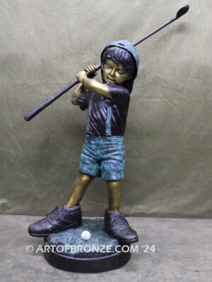 In My Fathers Shoes bronze sports statue of budding golfer boy hitting ball